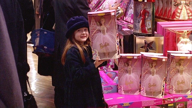 Helena holds up a fairy princess Barbie Doll, recalling the fairy wings she wears at the beginning of  Eyes Wide Shut  (1999)